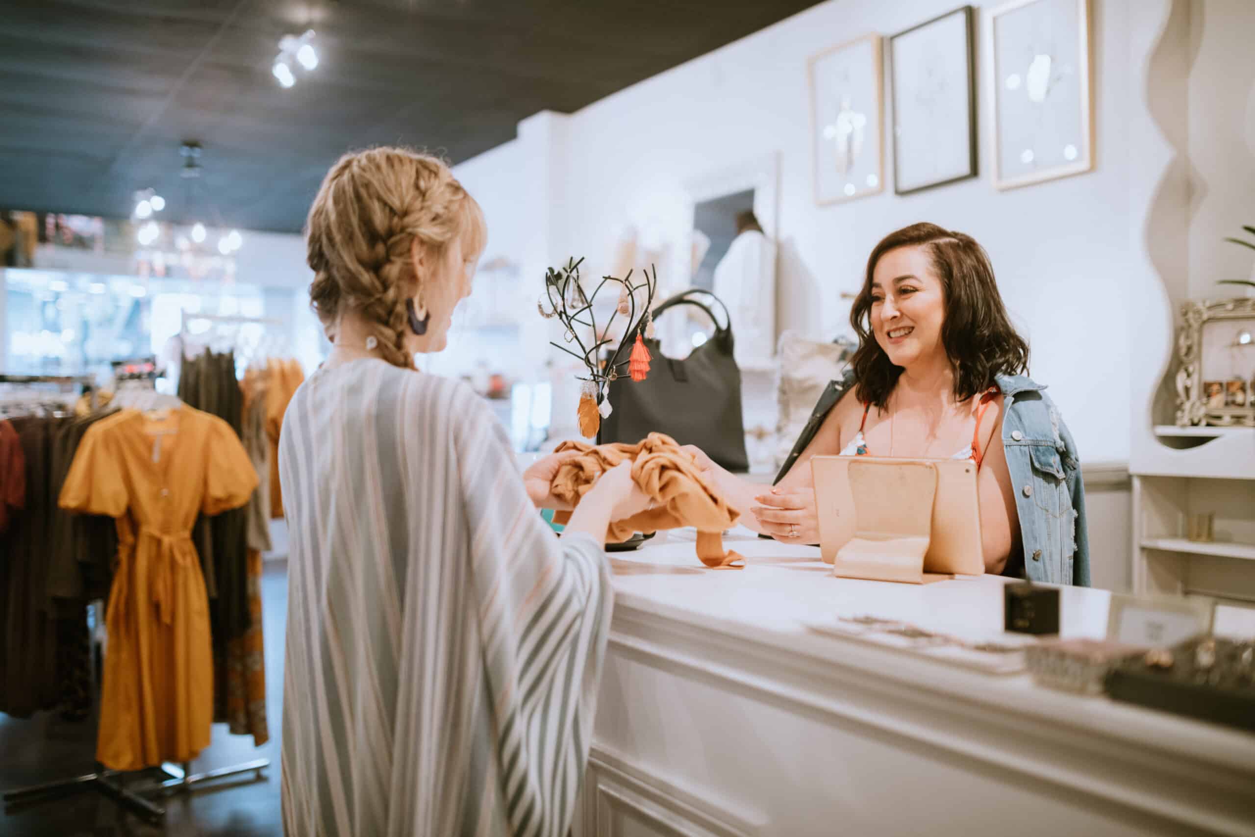 women buying clothing at a boutique