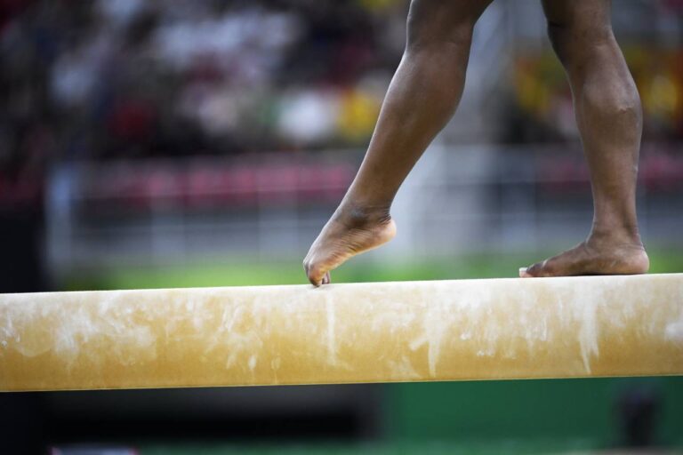 Simone Biles on a Balance Beam